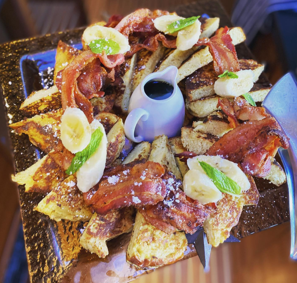 A fun breakfast platter is served for guests on a charter yacht